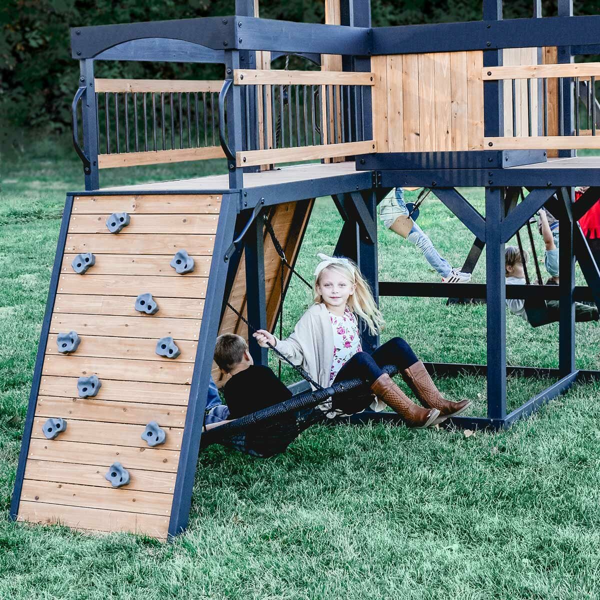 Lifestyle image of two children using the web swing Lifestyle image of two children using the web swing