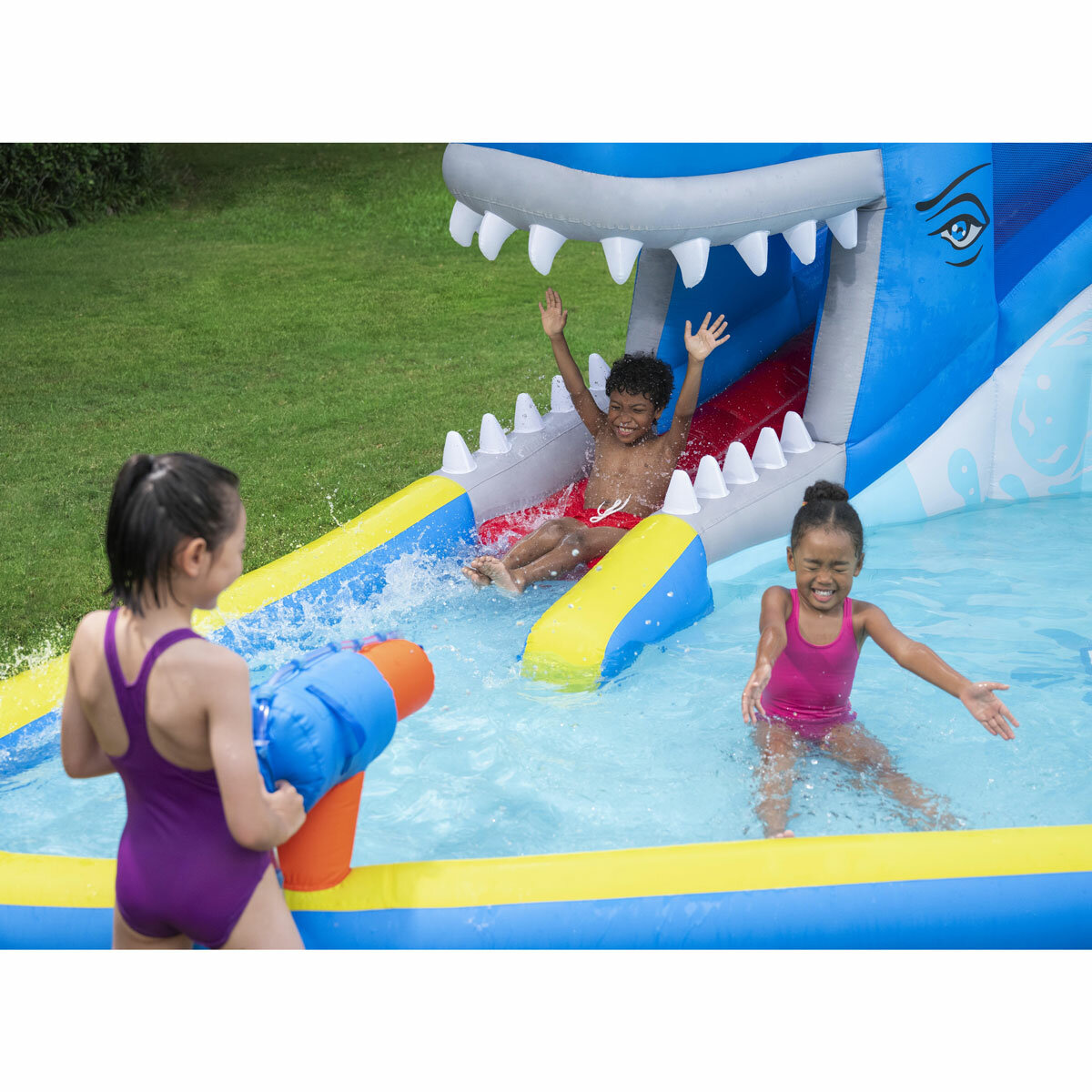 Lifestyle image of a child spraying other children with the water cannon Lifestyle image of a child spraying other children with the water cannon