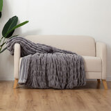 Textured faux fur throw on sofa