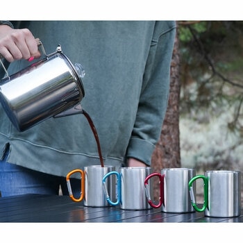 Lifestyle image of someone pouring coffee into a mug Lifestyle image of someone pouring coffee into a mug