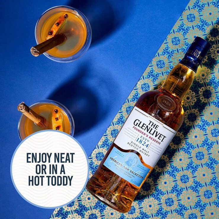 Lifestyle image of bottle on colourful background with cocktail Lifestyle image of bottle on colourful background with cocktail