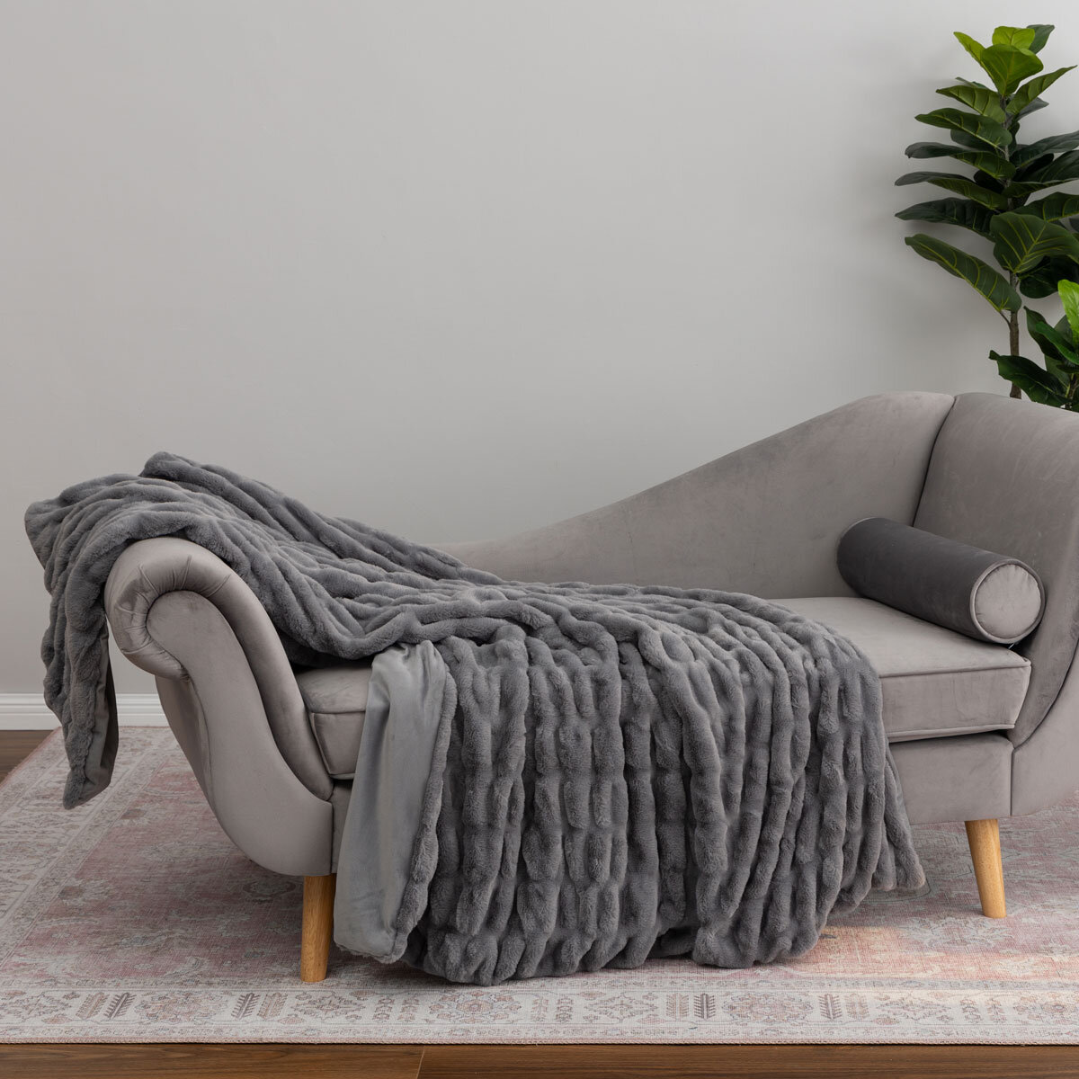 Textured faux fur throw on sofa