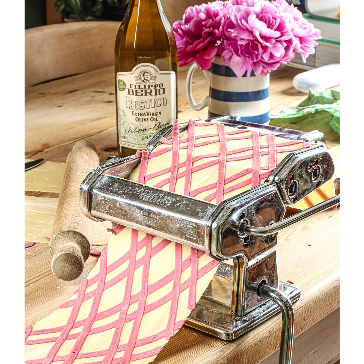 Bottle On A Table With Pasta Machine