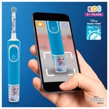 Image of someone taking a picture of Frozen Oral B toothbrush