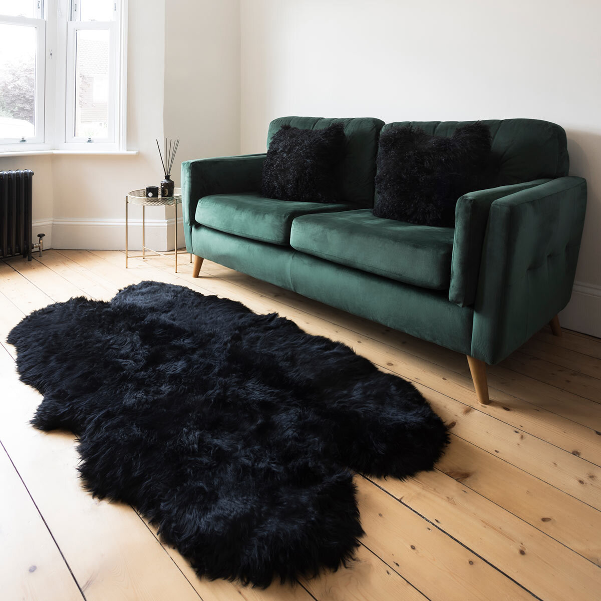 Naturally Sheepskin Quad Rug in Black close up on floor