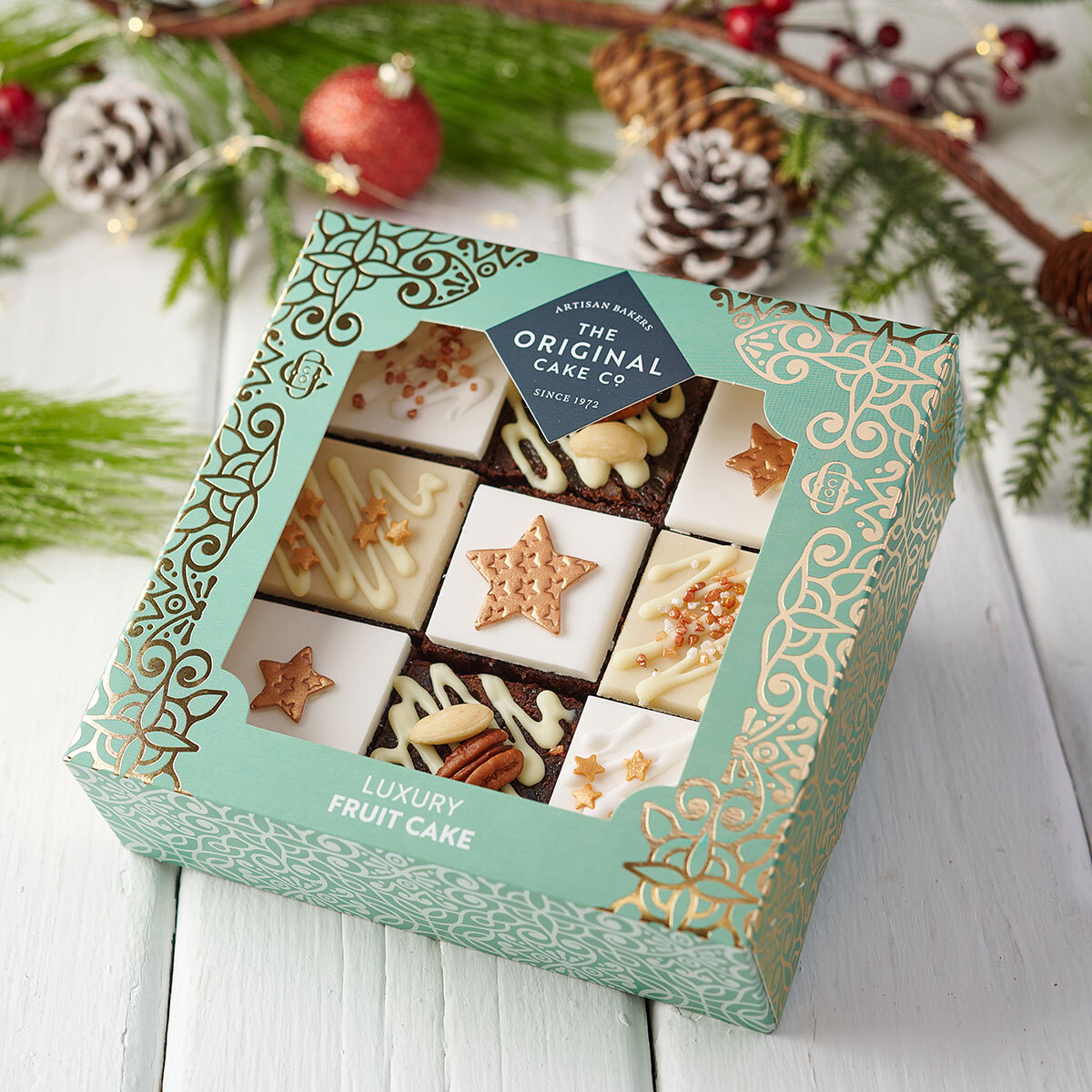 Fruit Cake with Pinecones and Baubles in Background