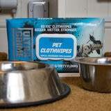 Pack of Wipes behind Dog Bowls