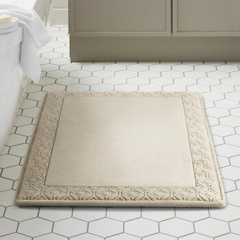 Taupe bath mat styled in a modern bathroom Taupe bath mat styled in a modern bathroom