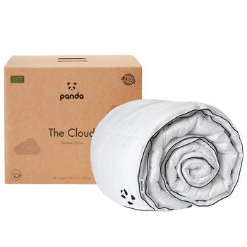 Rolled duvet infront of brown box packaging Rolled duvet infront of brown box packaging