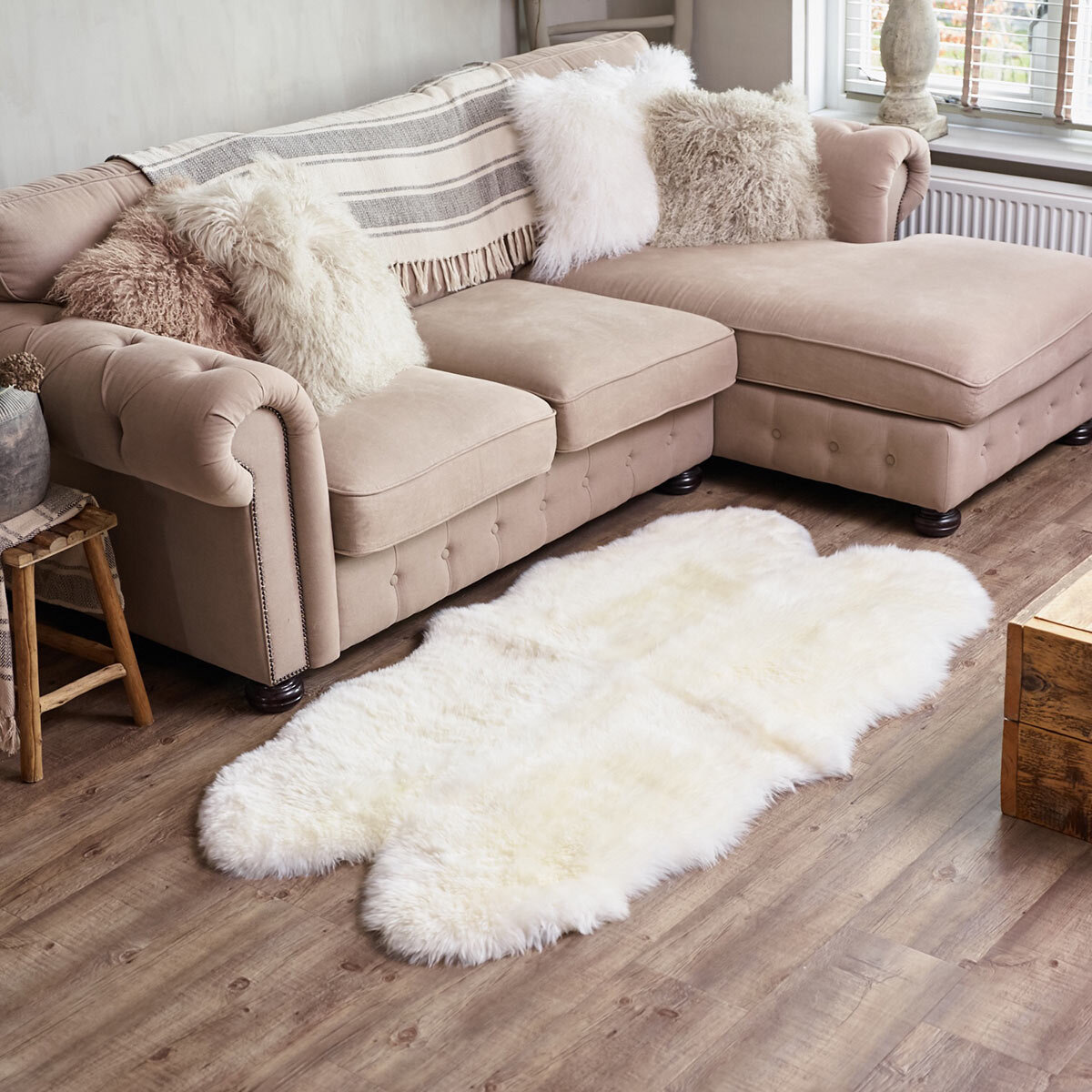 Naturally Sheepskin Quad Rug in Ivory in living room