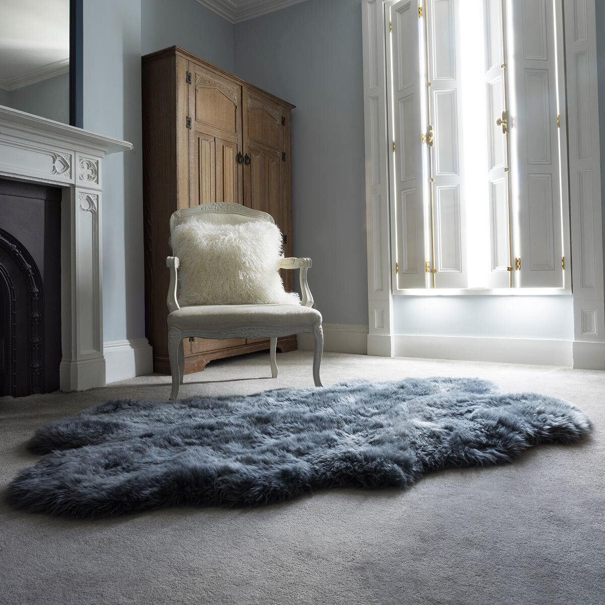 Naturally Sheepskin Quad Rug in Steel Grey on floor