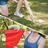 Lifestyle image showing a woman attaching the net to ground stakes for stability Lifestyle image showing a woman attaching the net to ground stakes for stability