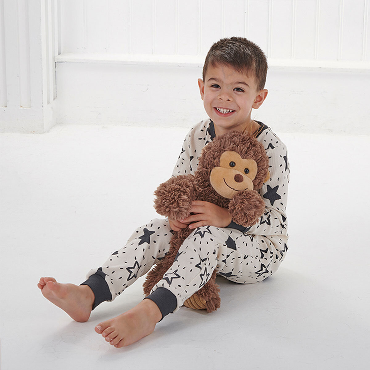 Boy Holding Monkey