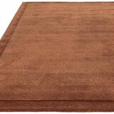 Asiatic Rise border rug in rust