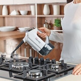 Lifestyle image of the Polti Vaporetta 3 detached and steam cleaning cooking hob