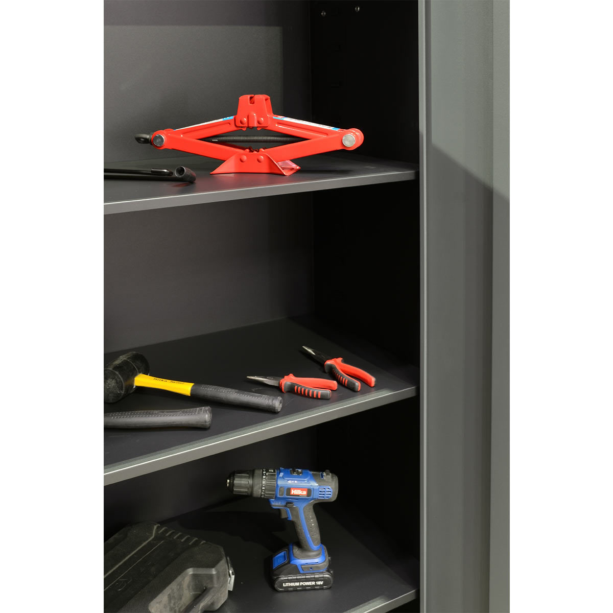 Open tool cabinet with tools in