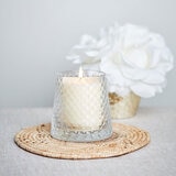 Lifestlye image of candle in clear glass