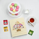 Box on a Table with Cup of Tea