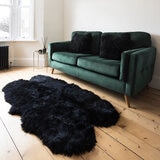 Naturally Sheepskin Quad Rug in Black close up on floor