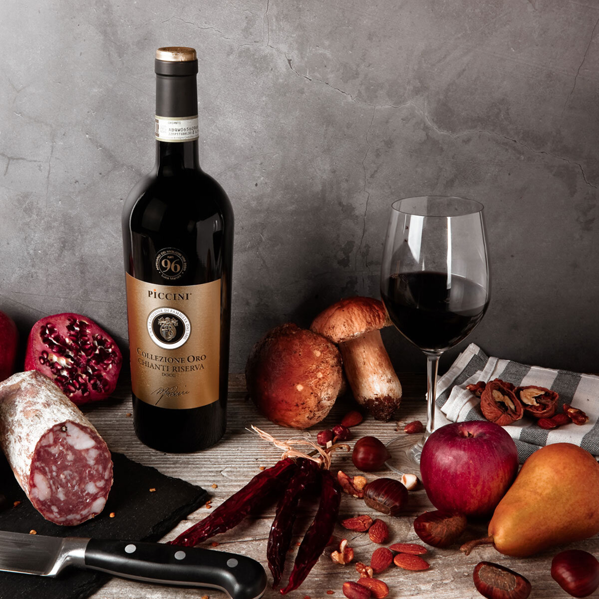 Piccini Collezione Oro Chianti Riserva surrounded by foods