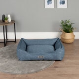 Lifestyle image of empty pet bed in living room setting