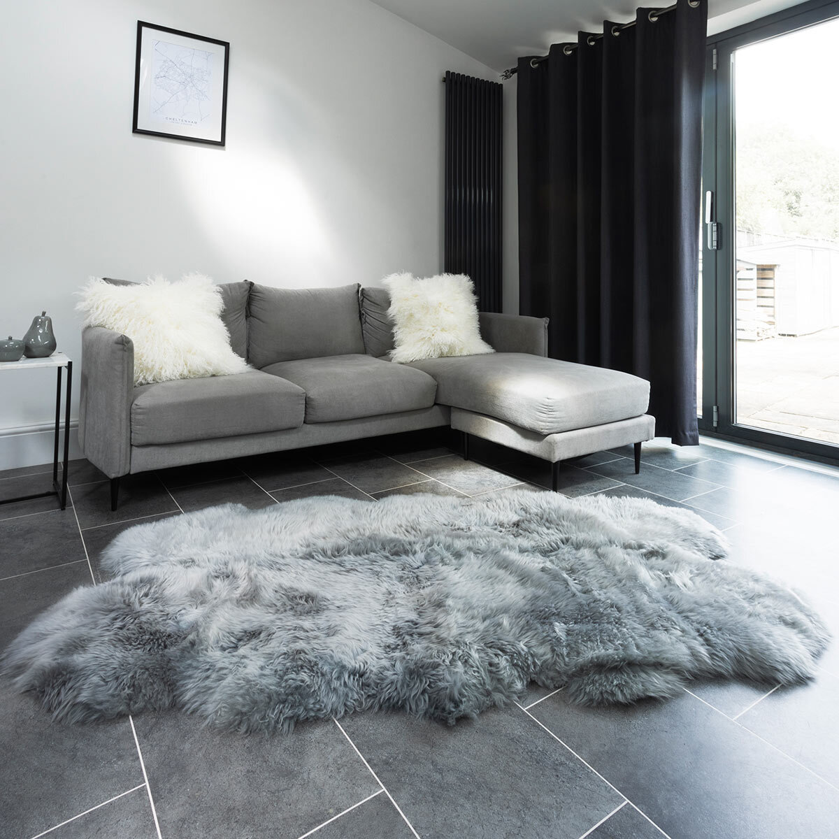 Naturally Sheepskin Quad Rug in Silver in living room