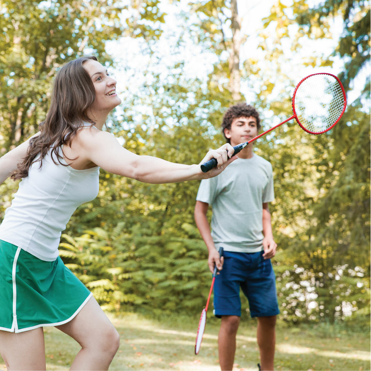 Lifestyle image of people playing badminton Lifestyle image of people playing badminton