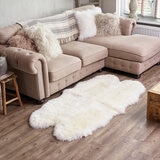 Naturally Sheepskin Quad Rug in a living room